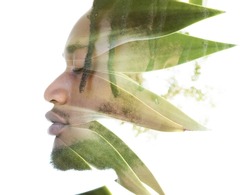 A double exposure portrait of a male model combined with an image of leaves.