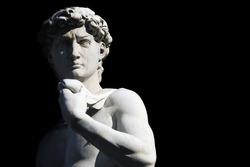 Michelangelo's David statue on black background, with place for your design or text