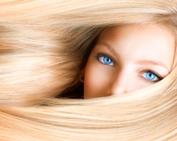 Blond Girl. Blonde Woman with Blue Eyes. Healthy Long Blond Hair. Hair Extension