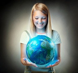 Girl holding the Planet  Earth. Future Concept