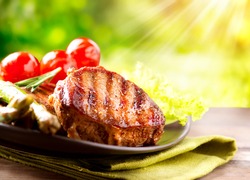 Grilled Beef Steak BBQ. Barbecue Meat Steak outdoor with Vegetables
