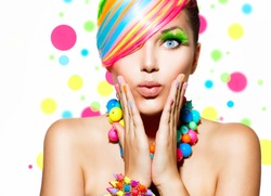 Beauty Girl Portrait with Colorful Makeup, Hair, Nail polish and Accessories. Colourful Studio Shot of Funny Woman. Vivid Colors. Manicure and Hairstyle. Rainbow Colors 