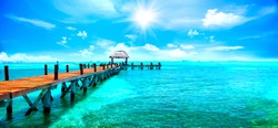 Exotic Paradise. Travel, Tourism and Vacations Concept. Tropical Resort. Caribbean sea Jetty near Cancun, Mexico