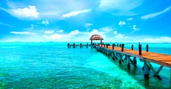 Exotic Paradise. Travel, Tourism and Vacations Concept. Tropical Resort. Caribbean sea Jetty near Cancun, Mexico.