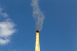 Smoke from the chimney of the crematorium according to the Thai Buddhist tradition
