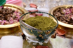 Henna powder in a glass container. Preparations for the henna night in the Moroccan wedding