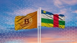 The flag of central african republic and the Bitcoin flag are waving over the blue sky