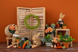 Easter backdrop or background for photo mini session in brown color. Contains straw rabbits.