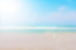 The blur cool sea background on horizon tropical sandy beach; relaxing outdoors vacation with heavenly mind view at a resort deck touching sunshine, sky surf summer clouds and light blue wave ocean.