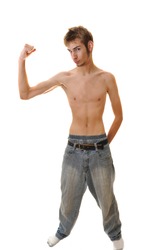 Slender young man flexing with no shirt isolated on a white background.