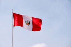 A large Peruvian flag waving in the wind.