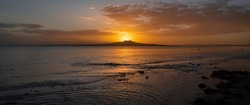 Rangitoto Island at dawn, Milford Beach, Auckland.