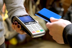 Payment by card, in the payment terminal. Electronic money. Mobile banking. Shopping complex