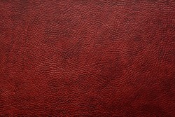 Elegant stylish dark brown bumpy leatherette background. Seamless texture. Element for interior. Free space for text or advertisement.