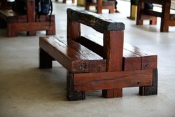 Recycle wooden chair made of wooden railway sleepers in train station.