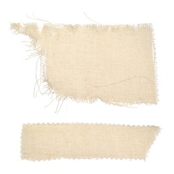 Pieces of ragged burlap shreds. Rectangular canvas patches. Texture background fabric in beige color isolated on a white background. The patch, cloth, garbage, dry waste, scraps of clothing.