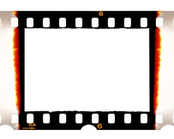 Old fashioned 35mm filmstrip or dia slide frame with burned edges isolated on white background. Real analog film scan with signs of usage.
