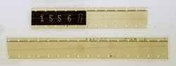 two blank long 16mm filmstrips or snips on white fixed by transparent sticky tape
