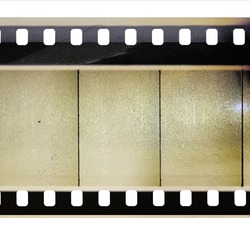 fictional 35mm cine filmstrip with empty or blank frames on white background and nice light reflection texture.