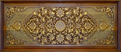 Beautiful Arabic patterns carved from wood on the door. Eastern architectural design.