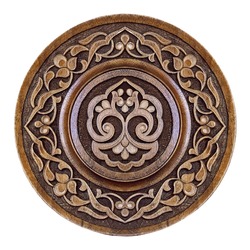 Arabic carved ornament on wooden plate, patterns. Souvenir carving plate.