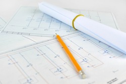 Printed electrical diagram, blurred background. Workplace of an electrician designer. Engineer's drawing on a white background