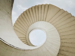 Brutalist spiral staircase with a view of the sky located in Warsaw, Poland