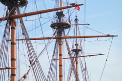 Sailing mast of ship. Sailing vessel main topgallant mast with crows nest. Old frigate warship