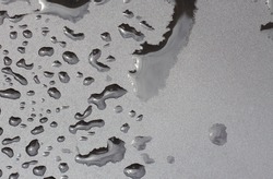 water drops on black waterproof background. Liquid stamping texture.