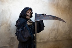 Message of Grim Reaper leaning against a scythe
