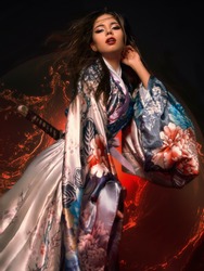 beautiful brunette girl in a kimono. model in asian clothes. geisha 