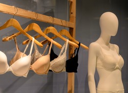 bras on hangers and mannequin for fitting