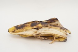 a pile of rotten banana skins on white background