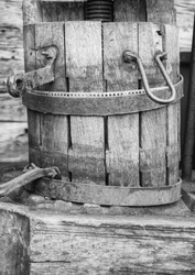 A historic wooden bucket with an iron ring