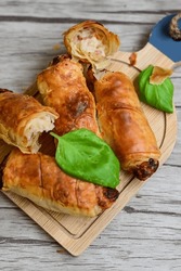  Greek style Mini filo pastry rolls with bacon and cheddar cheese .Home made bakery .Fresh baked  Mini cheese  ,meat and herbs puff pastries