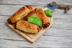  Greek style Mini filo pastry rolls with bacon and cheddar cheese .Home made bakery .Fresh baked  Mini cheese  ,meat and herbs puff pastries