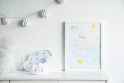 The modern scandinavian newborn baby room with mock up poster frame, white clouds and cotton lamps . 
