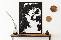 Design scandinavian interior of living room with wooden console, rings on the wall, black vases , hourglass and elegant personal accessories. Stylish mock up poster map. Modern home decor. Template. 