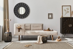 Modern ethnic living room interior with design chaise lounge, round mirror, furniture, carpet, decoration, stool and elegant personal accessories. Template. Stylish home decor.