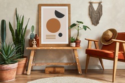 Creative composition of stylish living room interior with mock up poster frame, armchair, cacti and personal and boho accessories. Plant love and nature concept. Template.