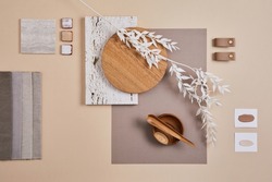 Creative flat lay composition with textile and paint samples, panels and cement tiles. Stylish interior designer moodboard. Light beige color palette. Copy space. Template. 
