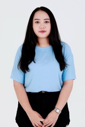 Portrait close up studio shot of Asian young chubby plump long black hair female model wearing blue casual t shirt and shorts with wrist watch standing look at camera on white background.