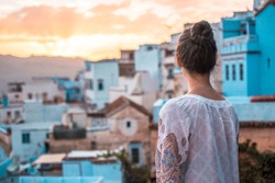 Girl enjoying the view in Chefchaouen Blue city Morocco
