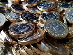 A pile of £1 coins.