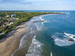 Playa Tamarindo, Guanacaste, Costa Rica - Drone Aerial view of Tamarindo Beach - best Surfing spot and Beach town on the Pacific Coast