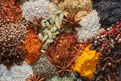 Spices. Aromatic Indian spices on a slate background. Spices and herbs on a stone background. Assortment of Seasonings, condiments, Dry colorful condiments. Culinary, cooking ingredients