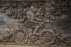 Statues and sculptures carved in stone. Details of famous balinese temples. Bali, Indonesia
