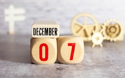 December 7th. Image of December 7 wooden color calendar on white canvas background. empty space for text