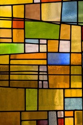 Multicolored stained glass church window, portrait orientation