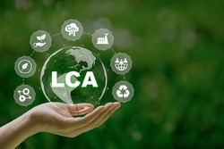 LCA, Life cycle assessment concept in hand. ISO LCA standard aims to limit climate change. Methodology for assessing environmental impacts associated on value chain product.